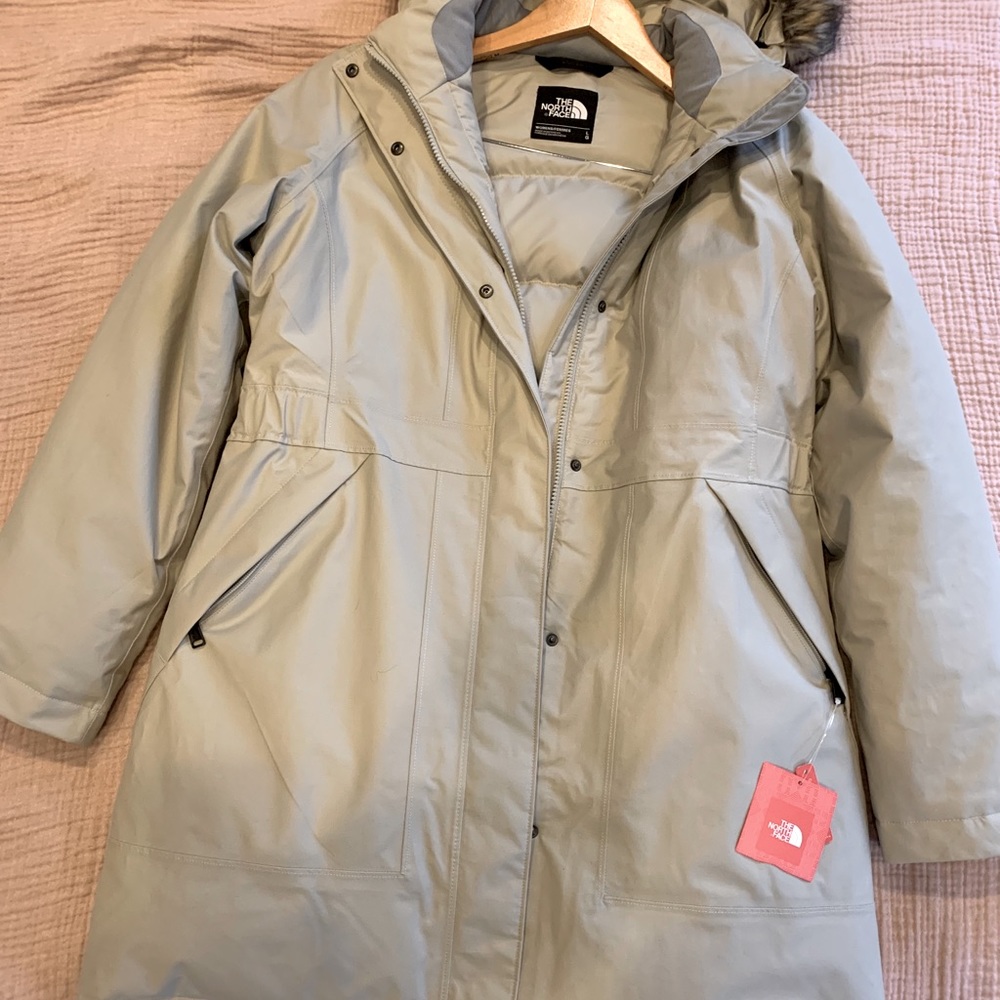 Never worn beautiful tan North face Parka